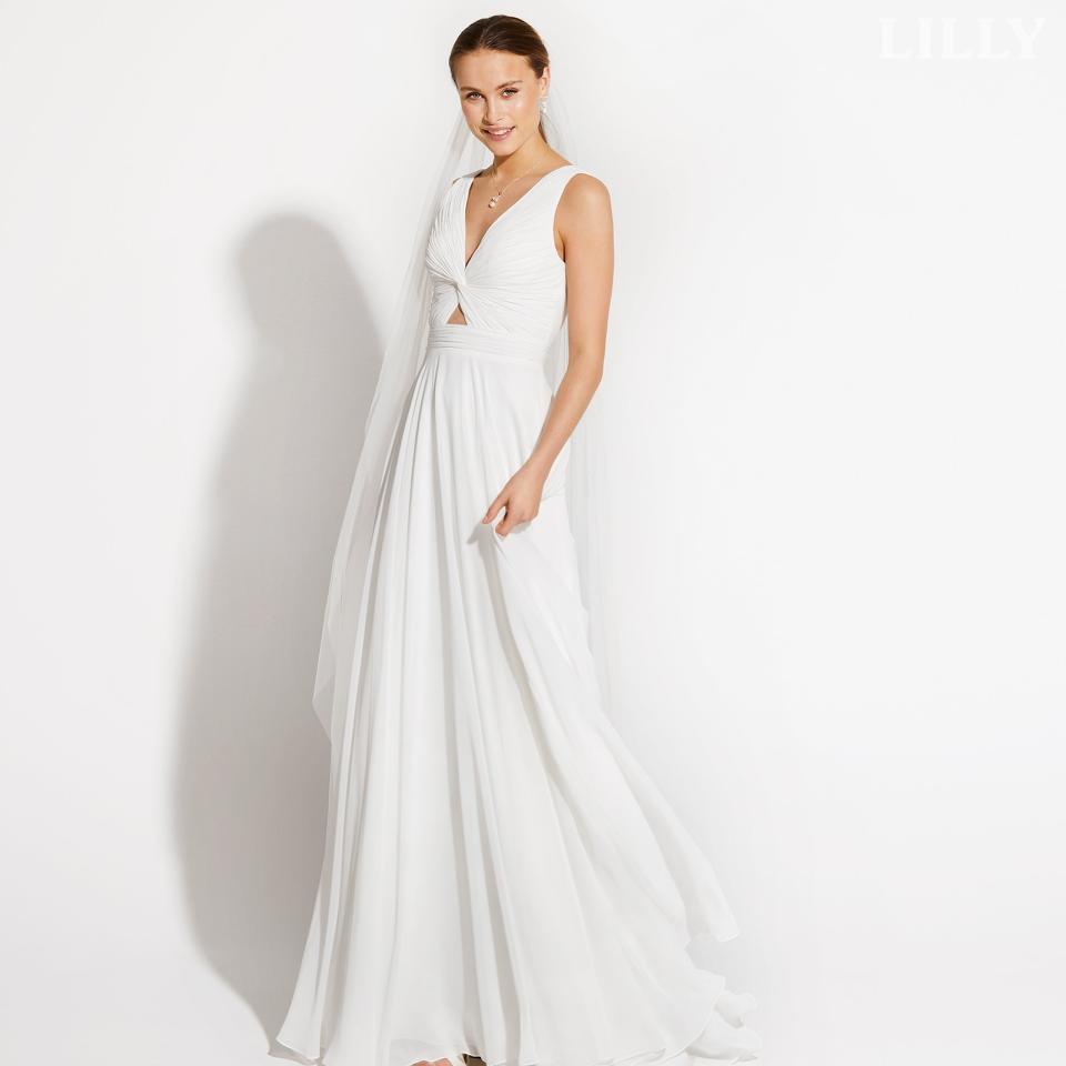 Florlet brudekjole med draperet overdel og elegant placeret kig til huden